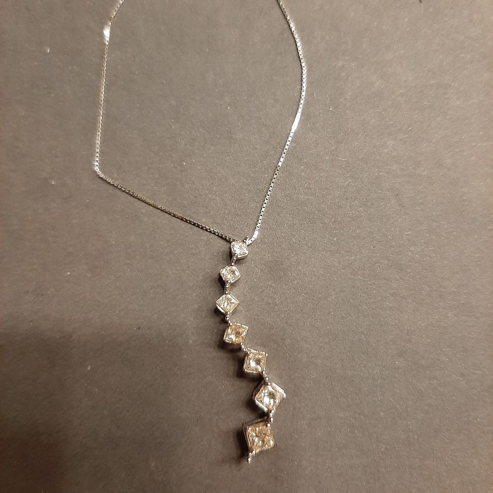 10k white gold and multiple diamond pendant with c